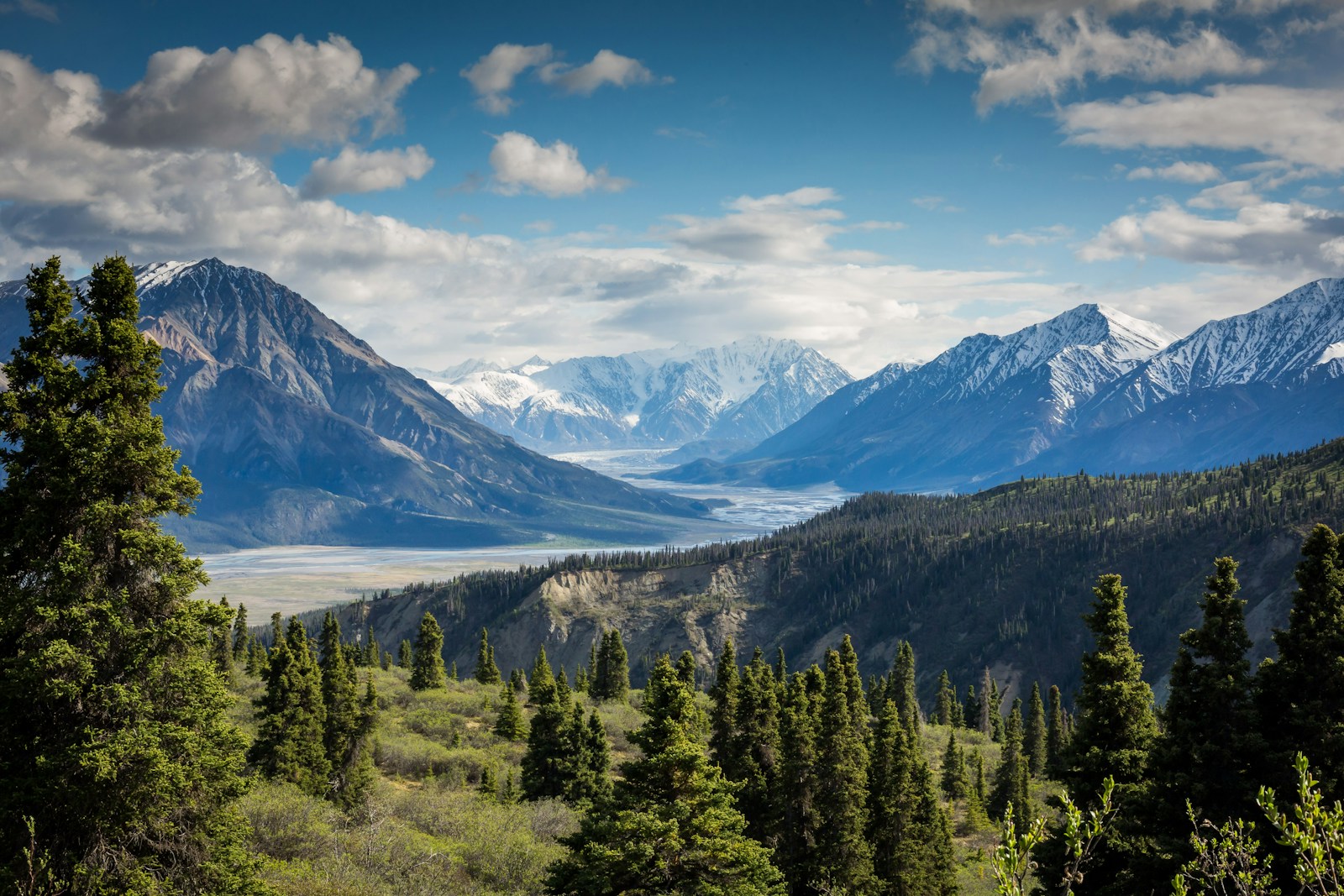 Mountain peaks opening onto a green valley
